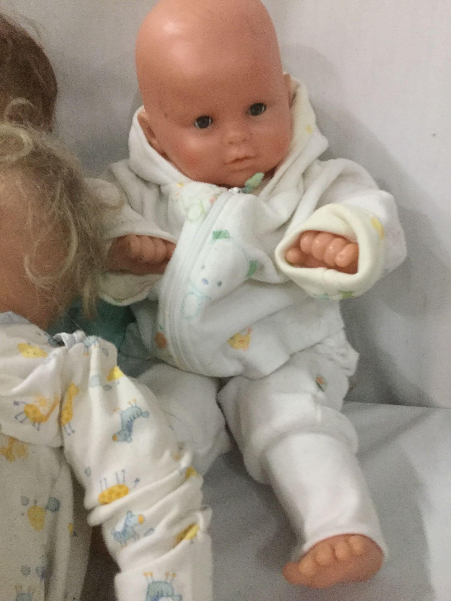 Six vinyl and composite baby dolls from makers like World Doll and Berenguer. Largest doll approx.