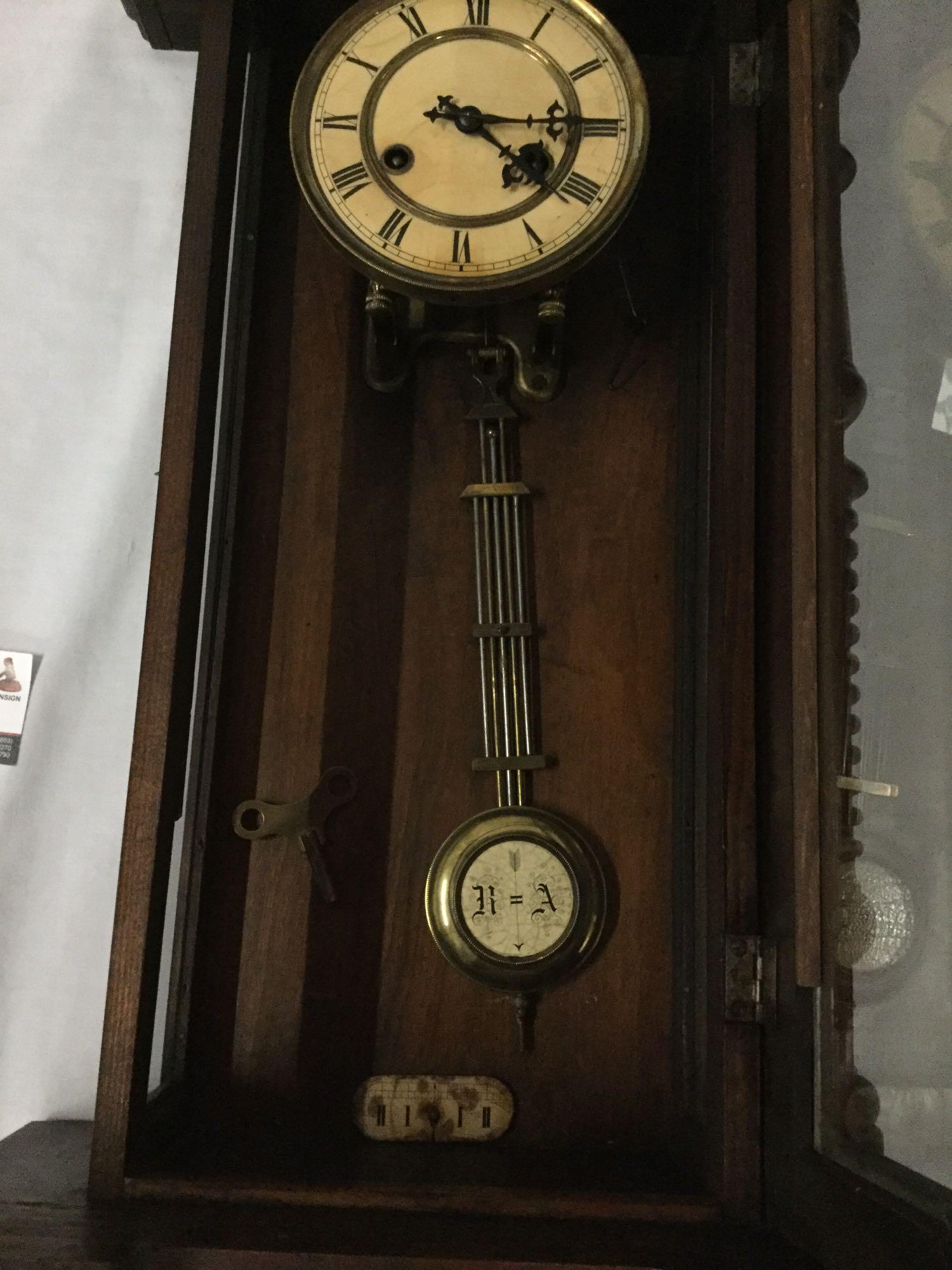 Antique German RA time strike wall clock with mahogany case, steeple topper and pendulum