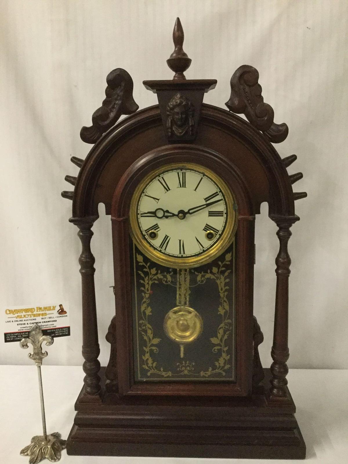 Antique time strike mantle clock with unique molding, floral design glass front & has pendulum/key