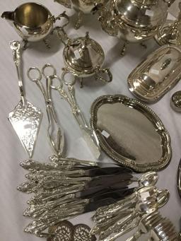 78 pc silver plate lot incl. candlesticks, teapots, silverware, cream and sugar, etc