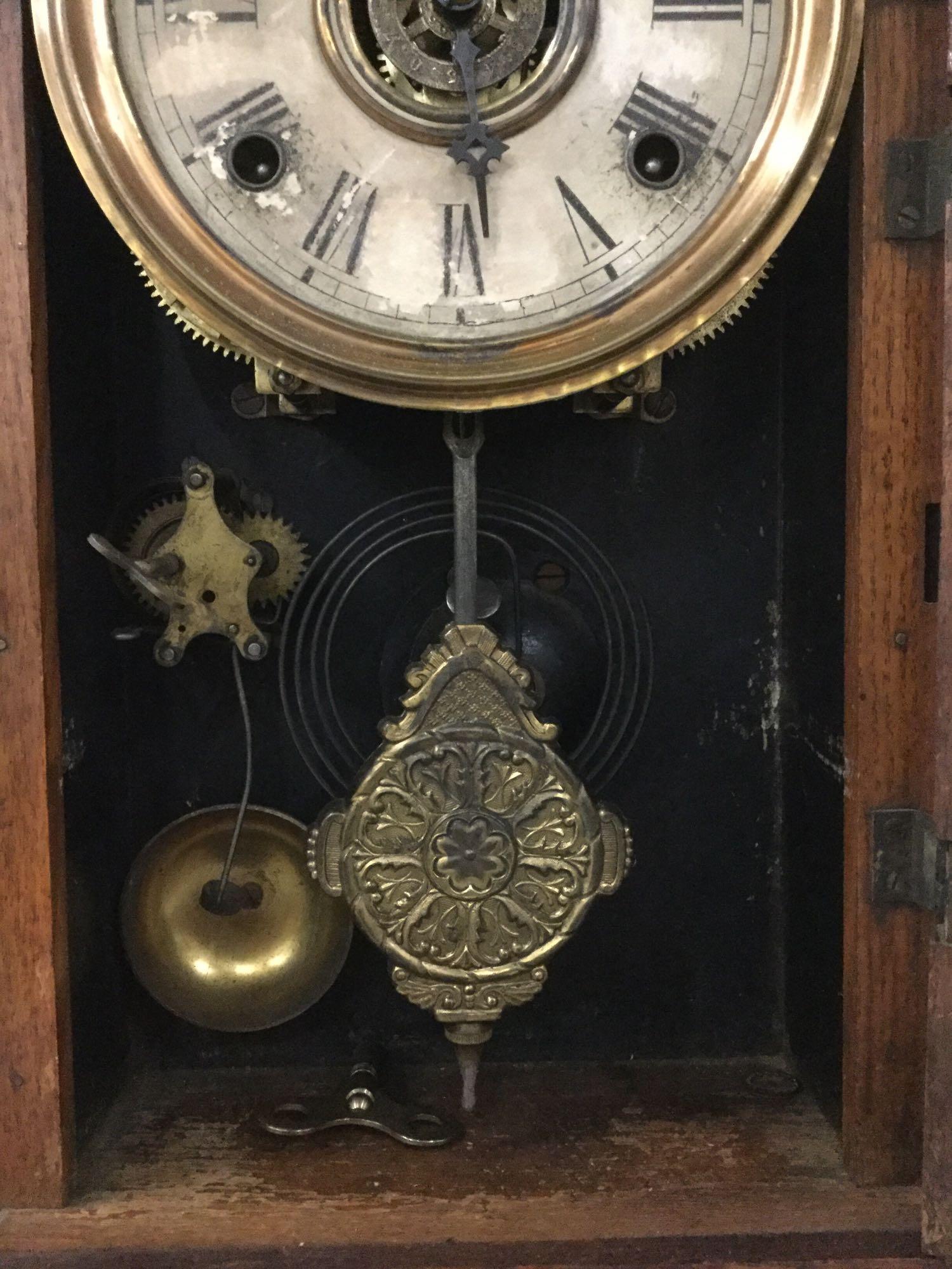 Antique oak time strike gingerbread kitchen clock with ornate floral molding & design glass front