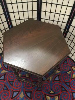 Vintage hexagonal side table with carved legs and side detail