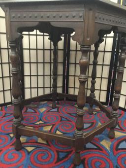 Vintage hexagonal side table with carved legs and side detail