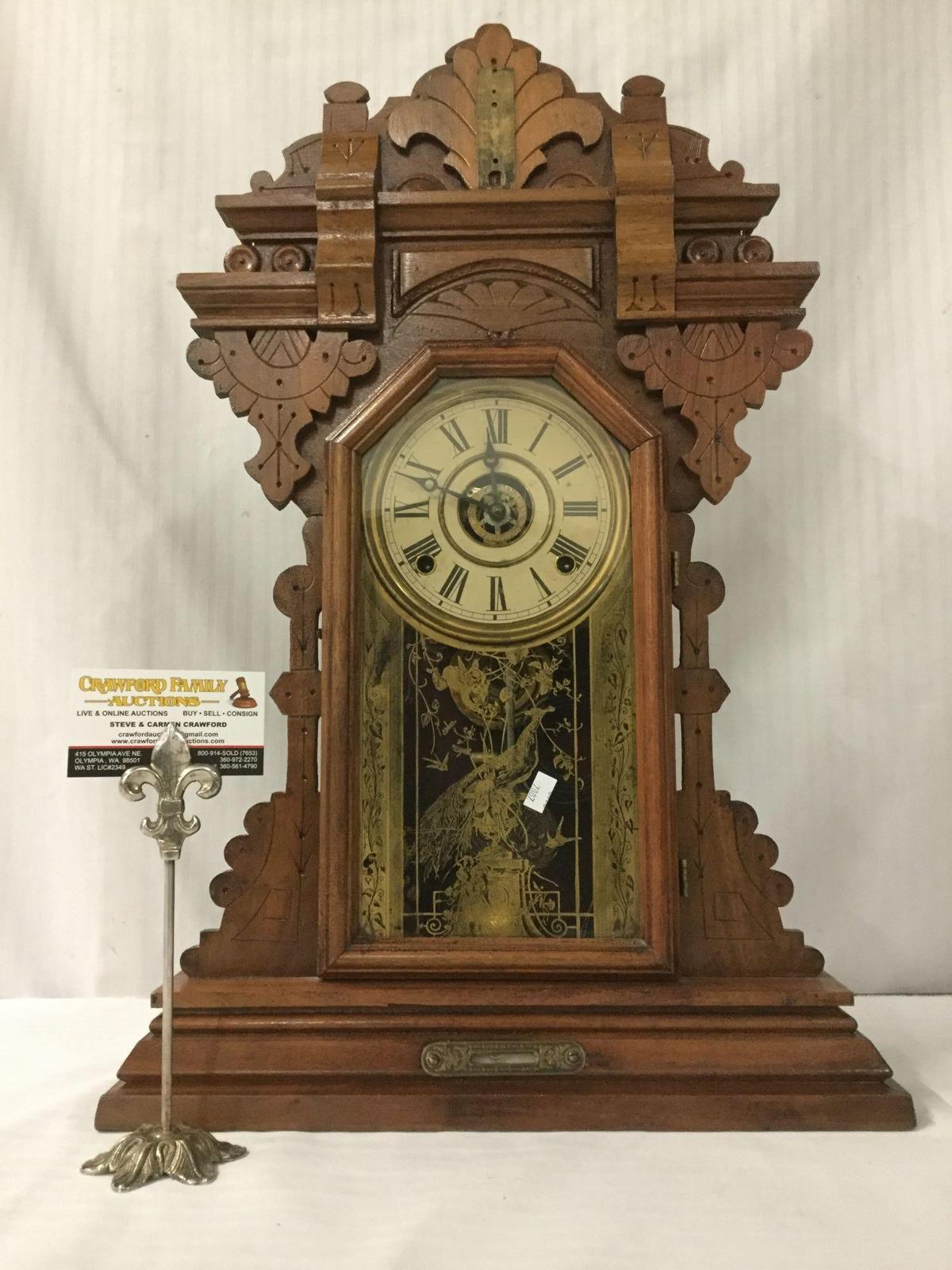 Antique eastlake period ornate mantle clock, time strike w/ peacock design glass front