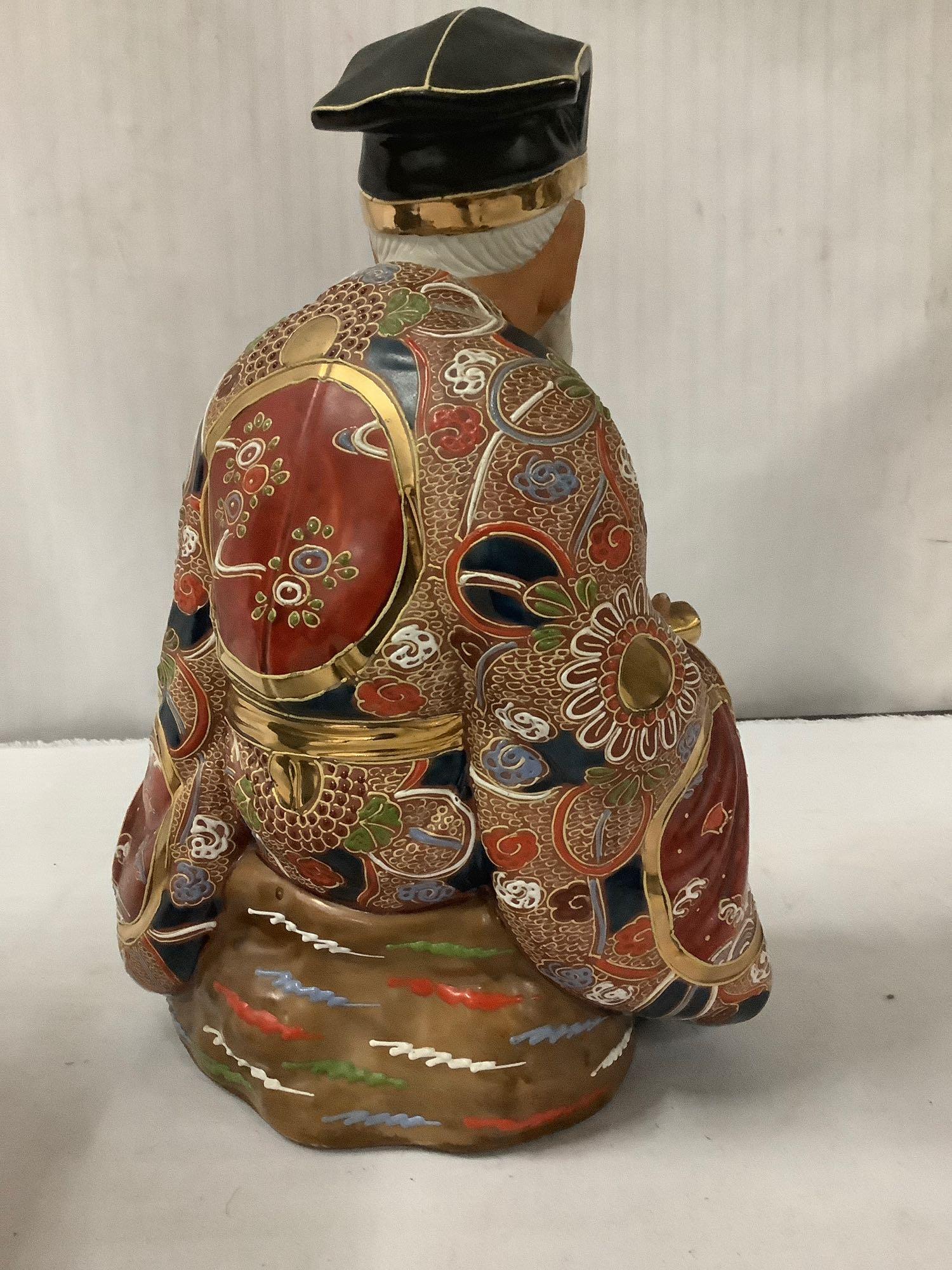 2 Asian Porcelain statues with bright colors - robed jubilant man (marked) + Imari painted elder