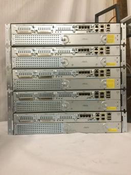 9 CiscoSystems routers and switches - 5 Cisco 2911 Integrated Services Routers, 2651XM router +