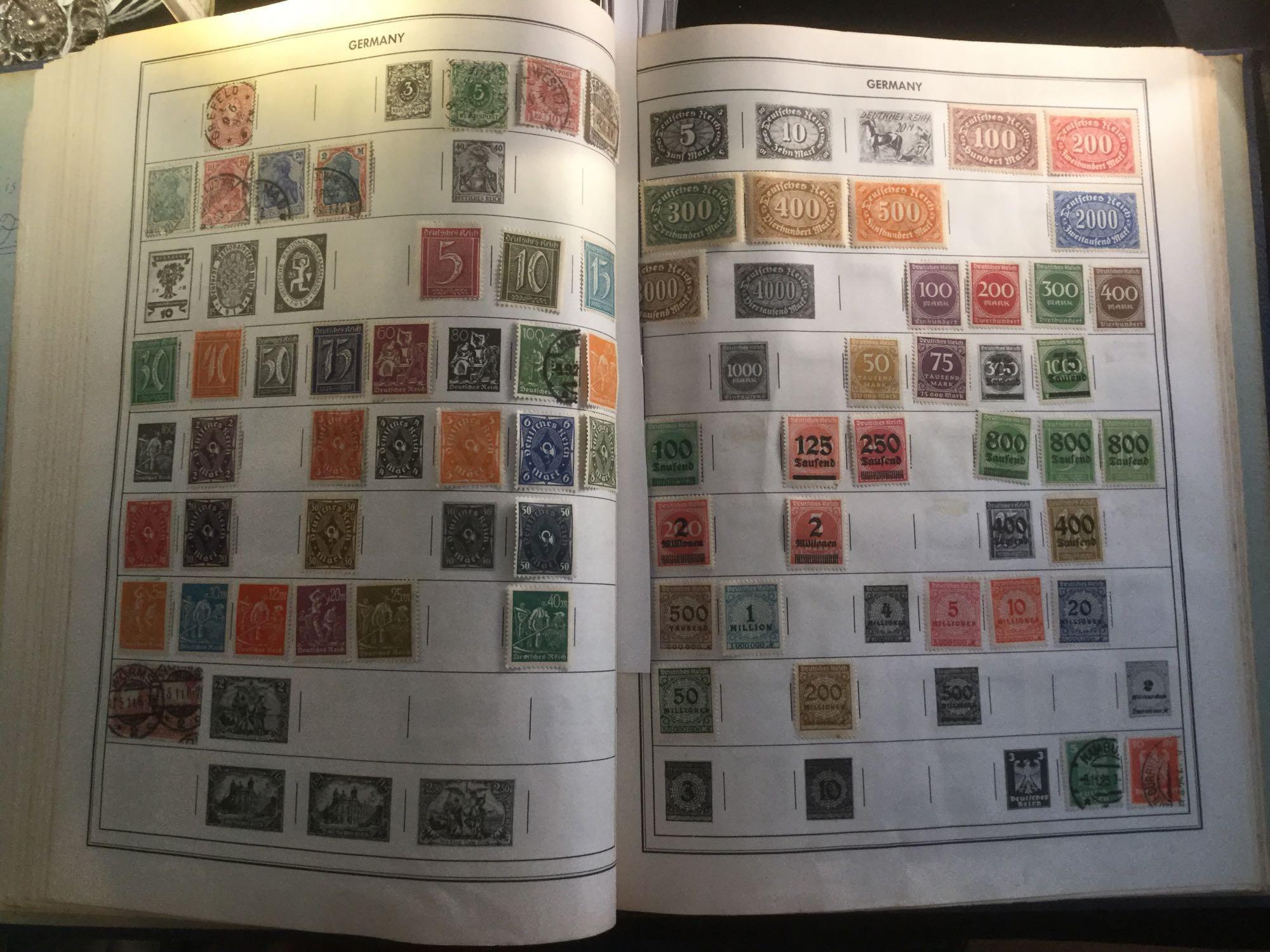 The Ambassador international Postage stamp album w/ hundreds of stamps, see pics