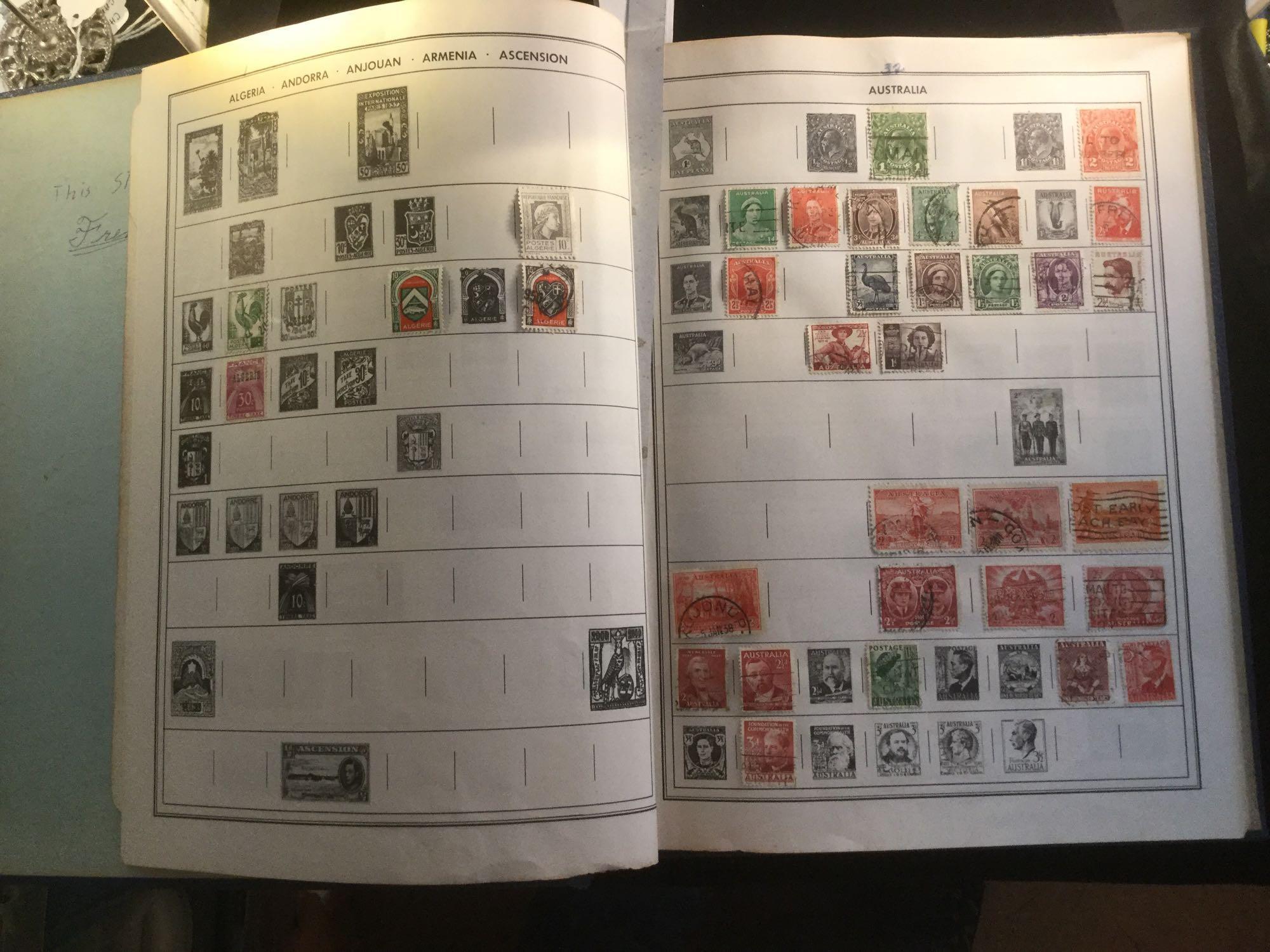 The Ambassador international Postage stamp album w/ hundreds of stamps, see pics