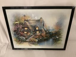 Framed print of cottage with flowers and swans in pond by Andres (?) approx 29.5 x 24 inches