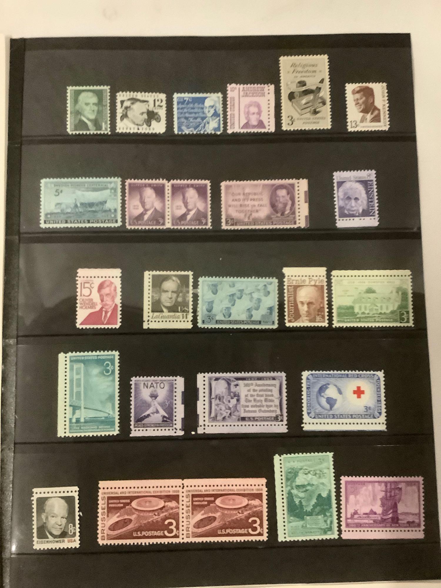 Four pages of early, regular, and commemorative US stamps all in mint condition.