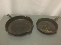 Three cast iron skillets and a Cabelas cast iron Dutch oven