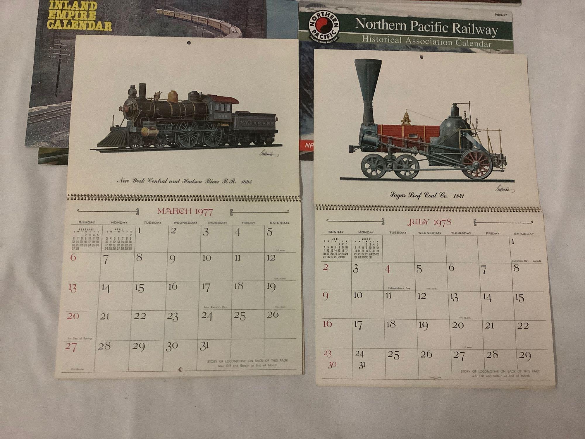 Collection of 7 old railroad calendars and magazines. Inland Empire, Northern Pacific and more