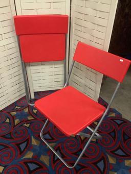 Pair of red IKEA - Jeff folding chairs, approx 20x31x17 inches opened.