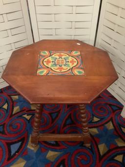 Vintage wooden octagonal small table with decorative tile top, approx 20x20x20 inches.