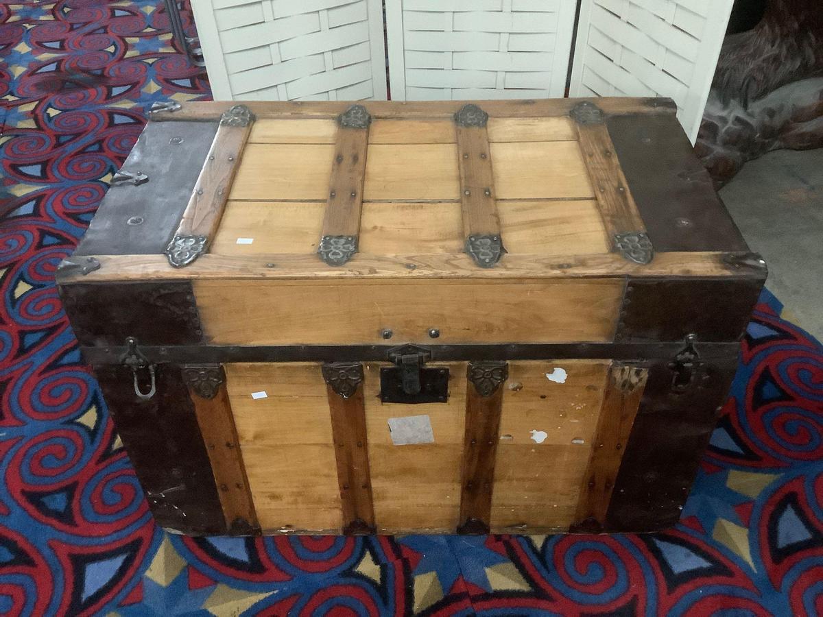 Vintage wooden steamer trunk, missing handles, approx 34 x 19 x 23 inches.