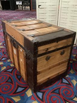 Vintage wooden steamer trunk, missing handles, approx 34 x 19 x 23 inches.