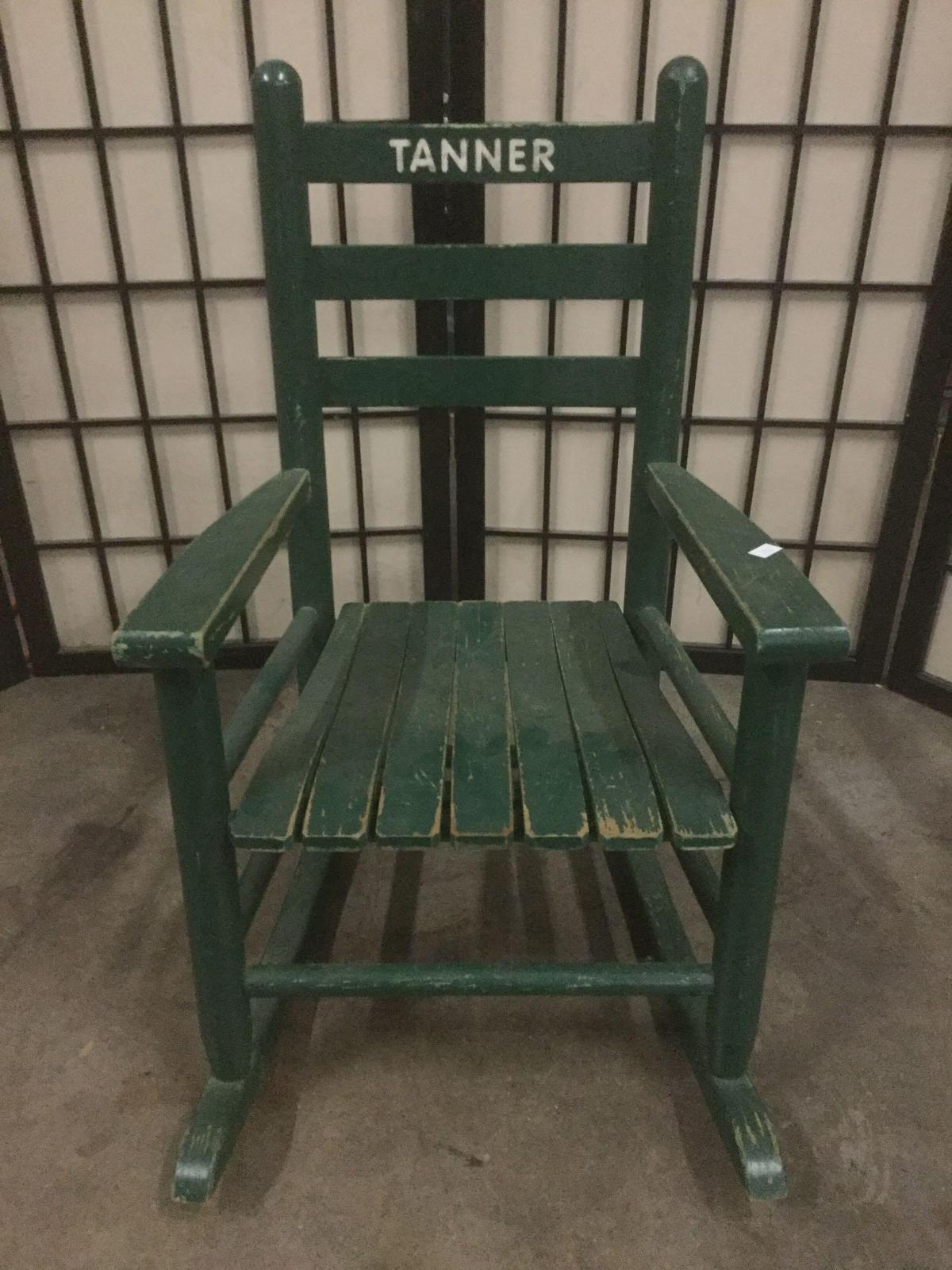 Green vintage childs rocking chair, Tanner printed on backrest, approx. 14x22x24 inches.