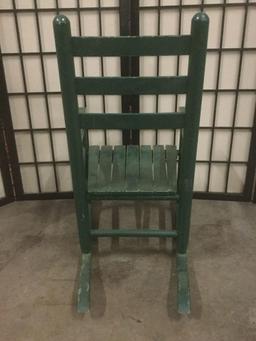 Green vintage childs rocking chair, Tanner printed on backrest, approx. 14x22x24 inches.