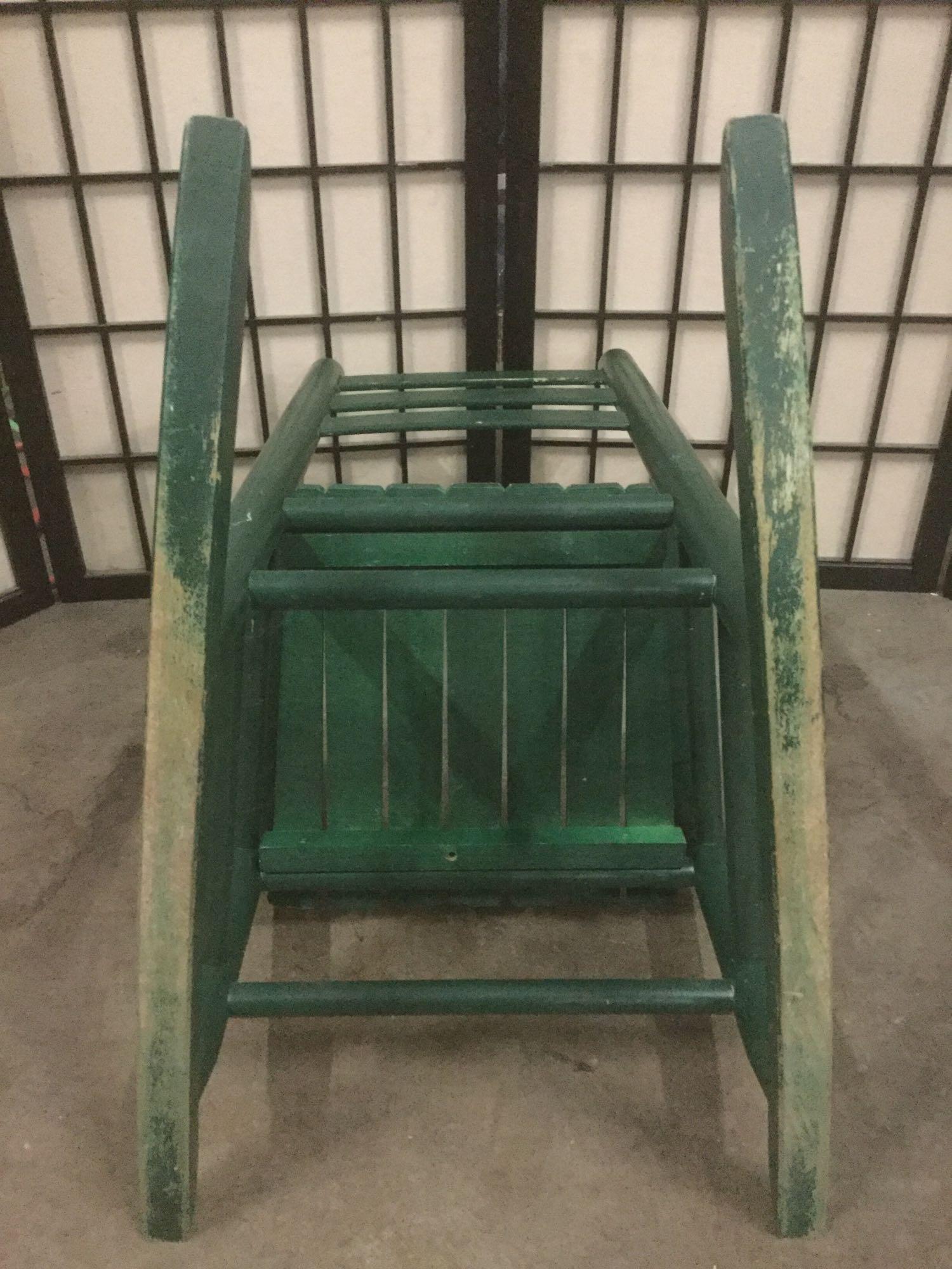 Green vintage childs rocking chair, Tanner printed on backrest, approx. 14x22x24 inches.