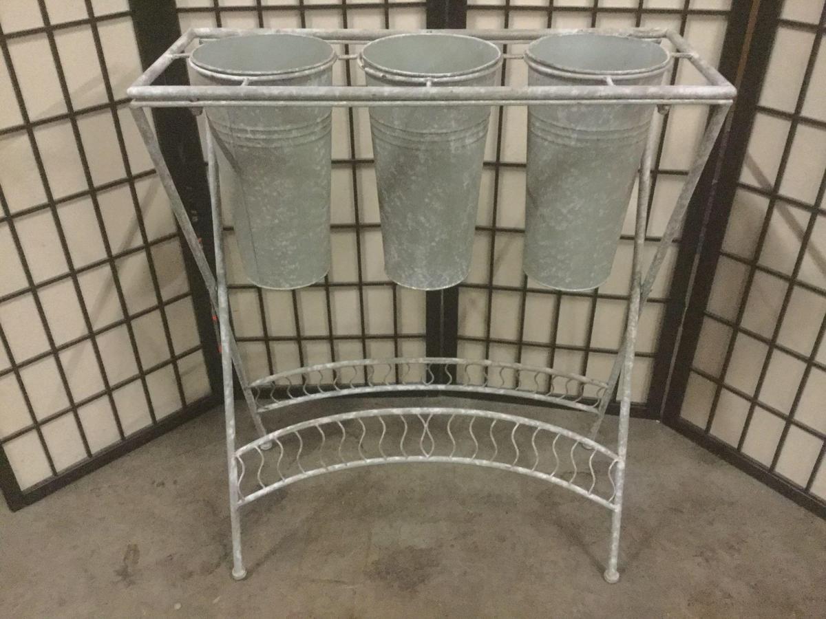 Metal three pot planter stand, approx. 26x11x31 inches.