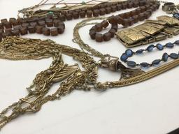 11 Pieces of vintage and modern estate jewelry. Longest piece measures approx 50 inches.