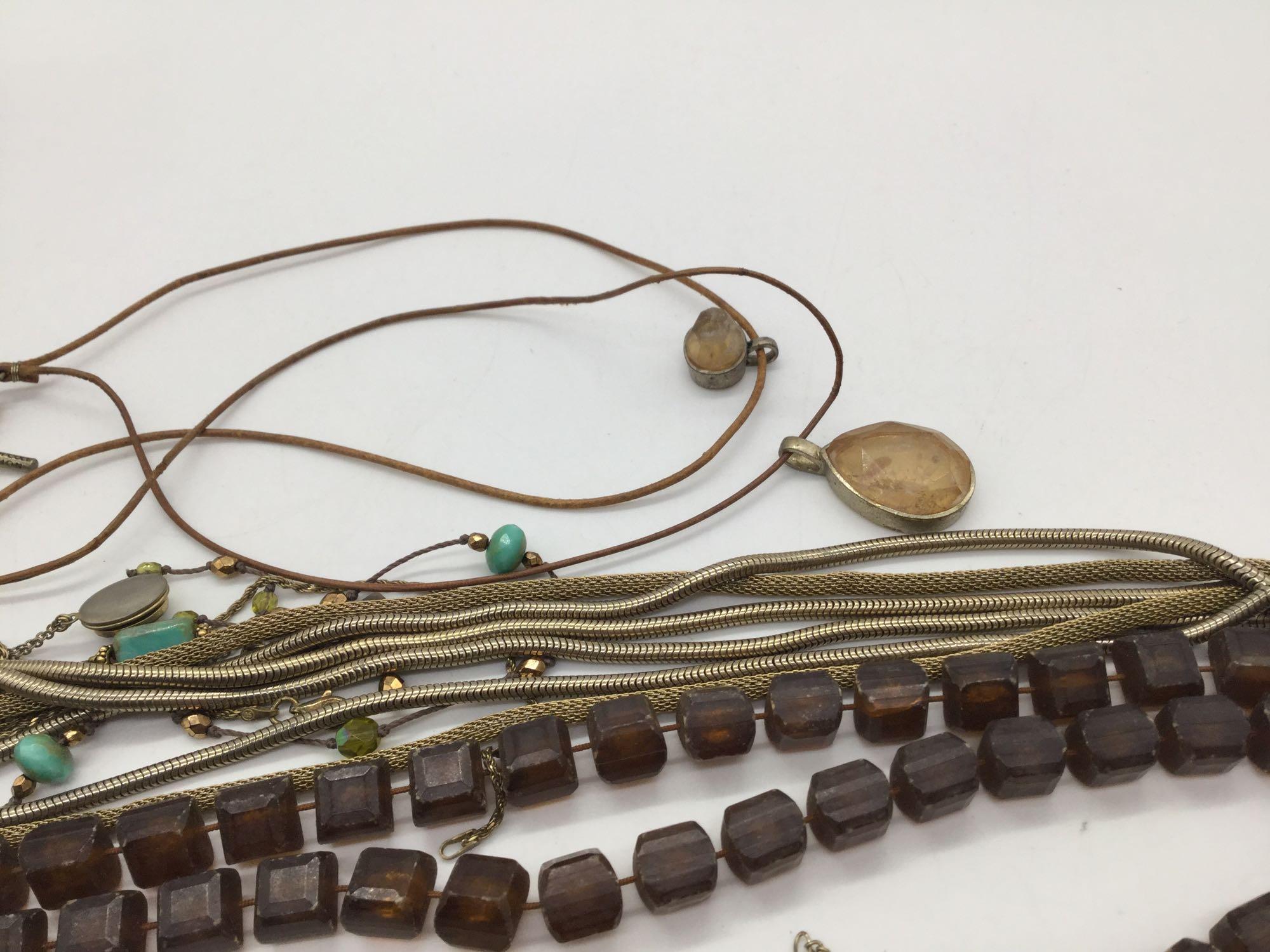 11 Pieces of vintage and modern estate jewelry. Longest piece measures approx 50 inches.