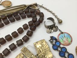 11 Pieces of vintage and modern estate jewelry. Longest piece measures approx 50 inches.