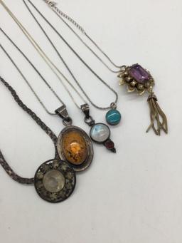 Collection of 5 antique and modern sterling silver necklaces some with stones.