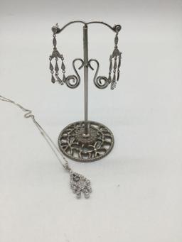 Matching sterling silver necklace and earrings.