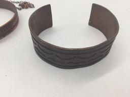 Two copper bracelets and copper and turquoise necklace.