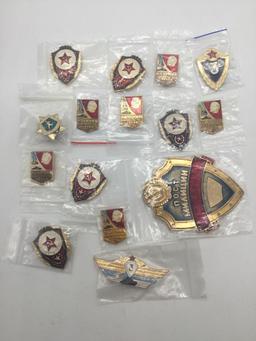 Former Russian KGB employee recognition badges.