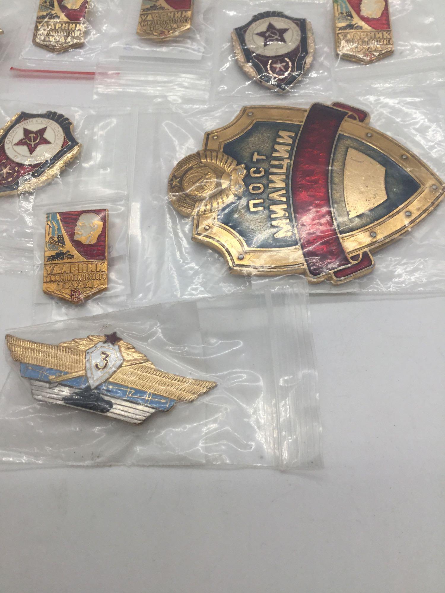 Former Russian KGB employee recognition badges.