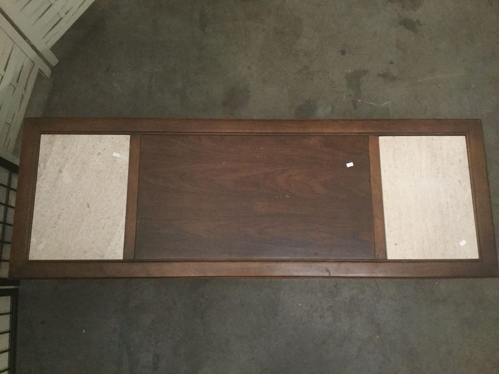 Wood coffee table w/two inlaid slabs of granite. Approx. 59x21x15 inches....