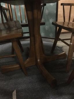 Vintage Conant Ball Furniture Co. round oak table with four chairs and two leaves. approx 44x44x30