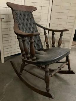 Antique wood carved rocking chair w/ leather seat and back, shows wear, 28 x 35 x 35 inches