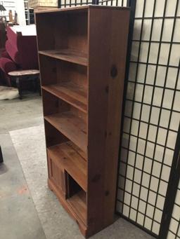 Wooden book shelf with bottom cabinet.