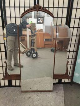 Vintage vanity mirror with carved accents. approx 52x43 inches.