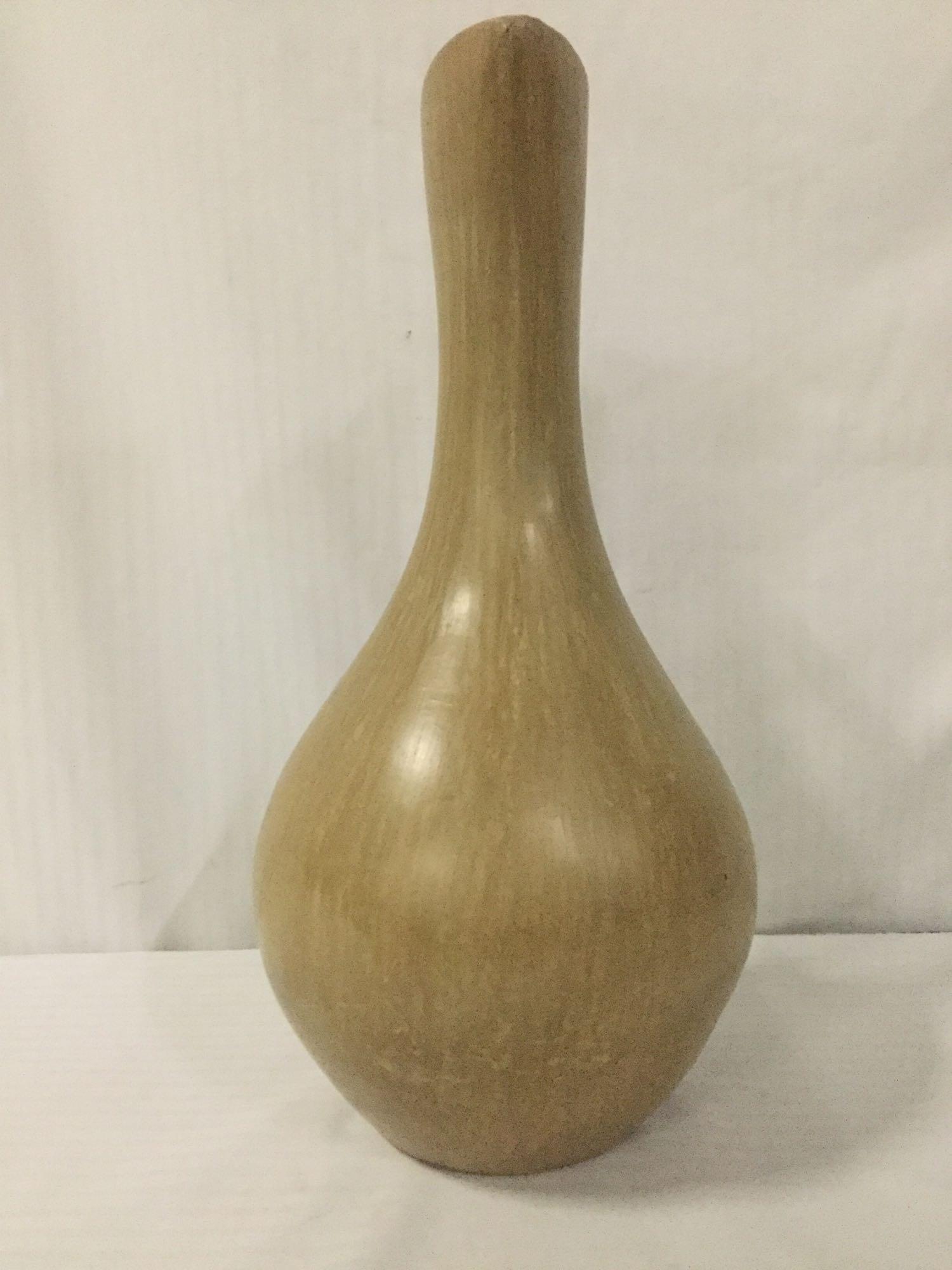 Tall smooth ceramic pitcher, unsigned, approx. 10x10x20.5 inches.