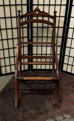 Antique wooden folding chair missing cushion. Approx 35x18x20 inches.