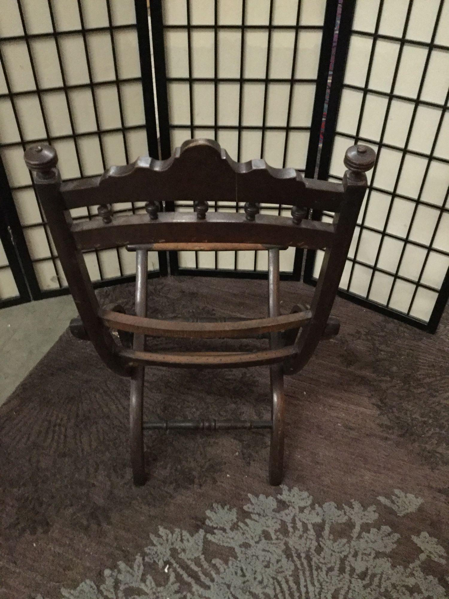 Antique wooden folding chair missing cushion. Approx 35x18x20 inches.