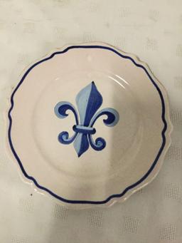 Set of three stoneware fleur-de-lis motif pieces signed by artist.