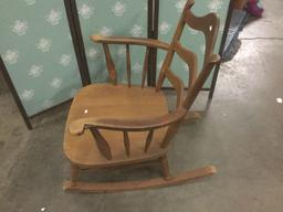 Vintage wide wooden rocking chair.