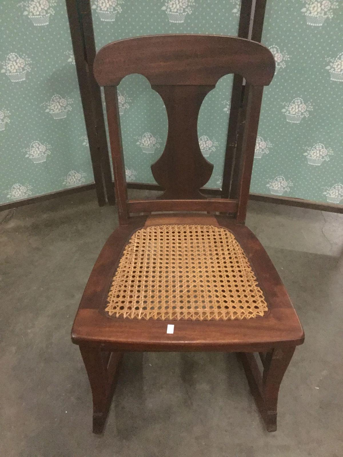 Vintage rattan seat child?s rocking chair.