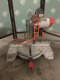 Ridged 10 inch miter saw. Tested and working. Approx 20x20x20 inches.