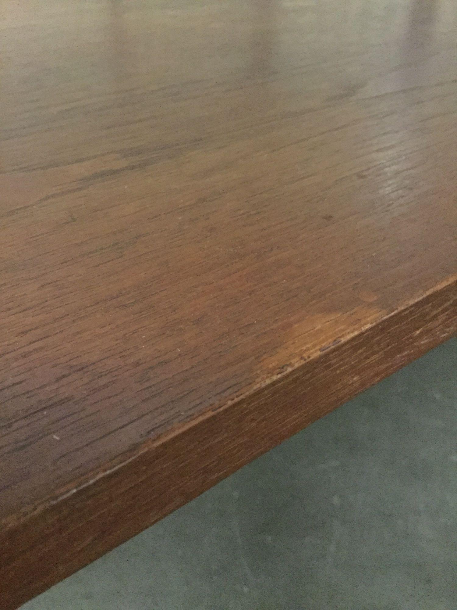 Modern style wood dining table w/ signs of wear & repair, see pics, approx. 64.5x37x28.5 inches.