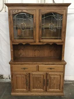 Modern oak 2 pc hutch cabinet with leaded glass door top and slight floral design