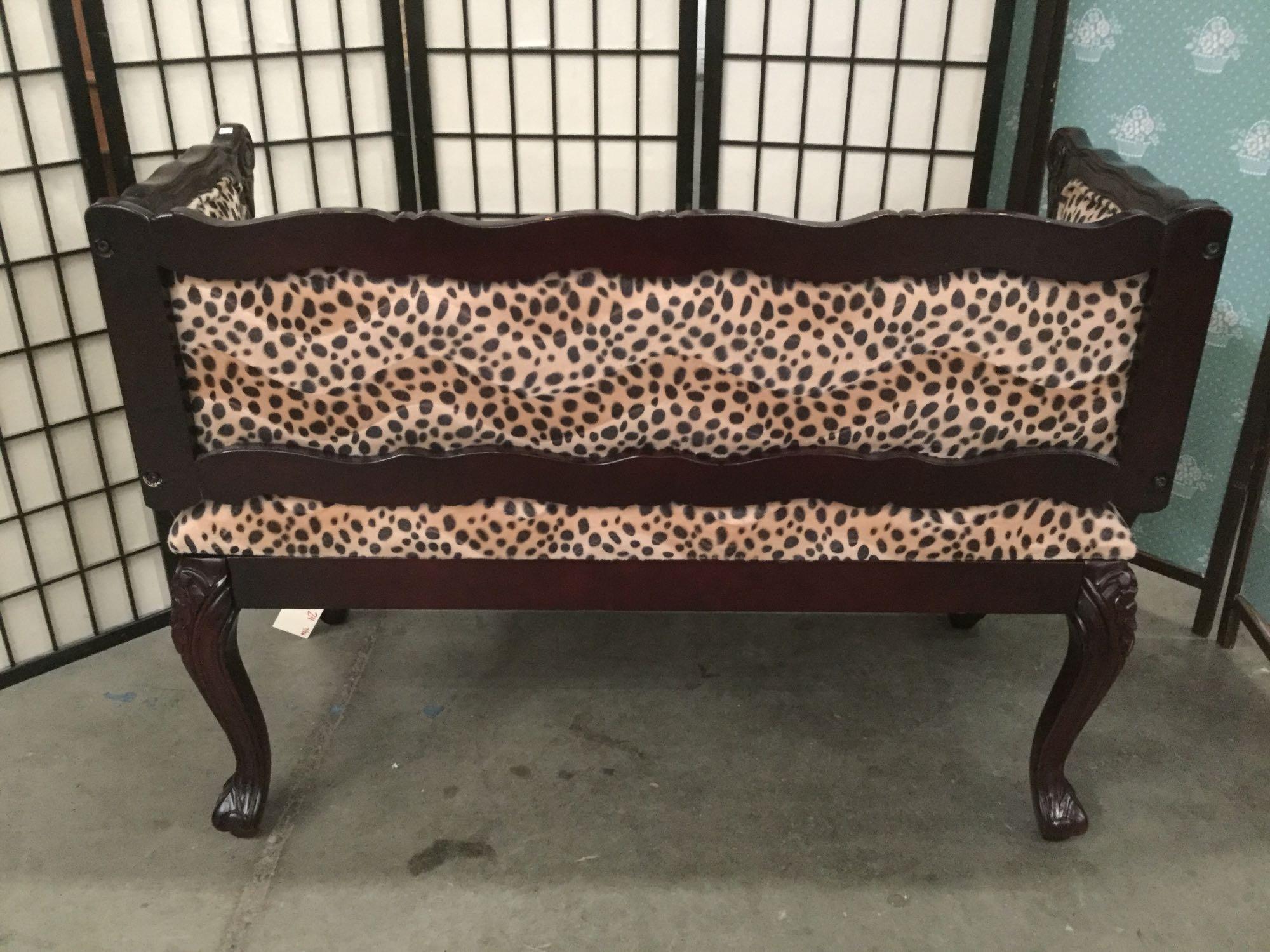 Modern cheetah print loveseat w/ swirling regal wood detailing & cabriole legs