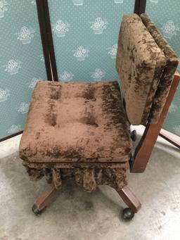 Vintage rolling office chair with velour style upholstery