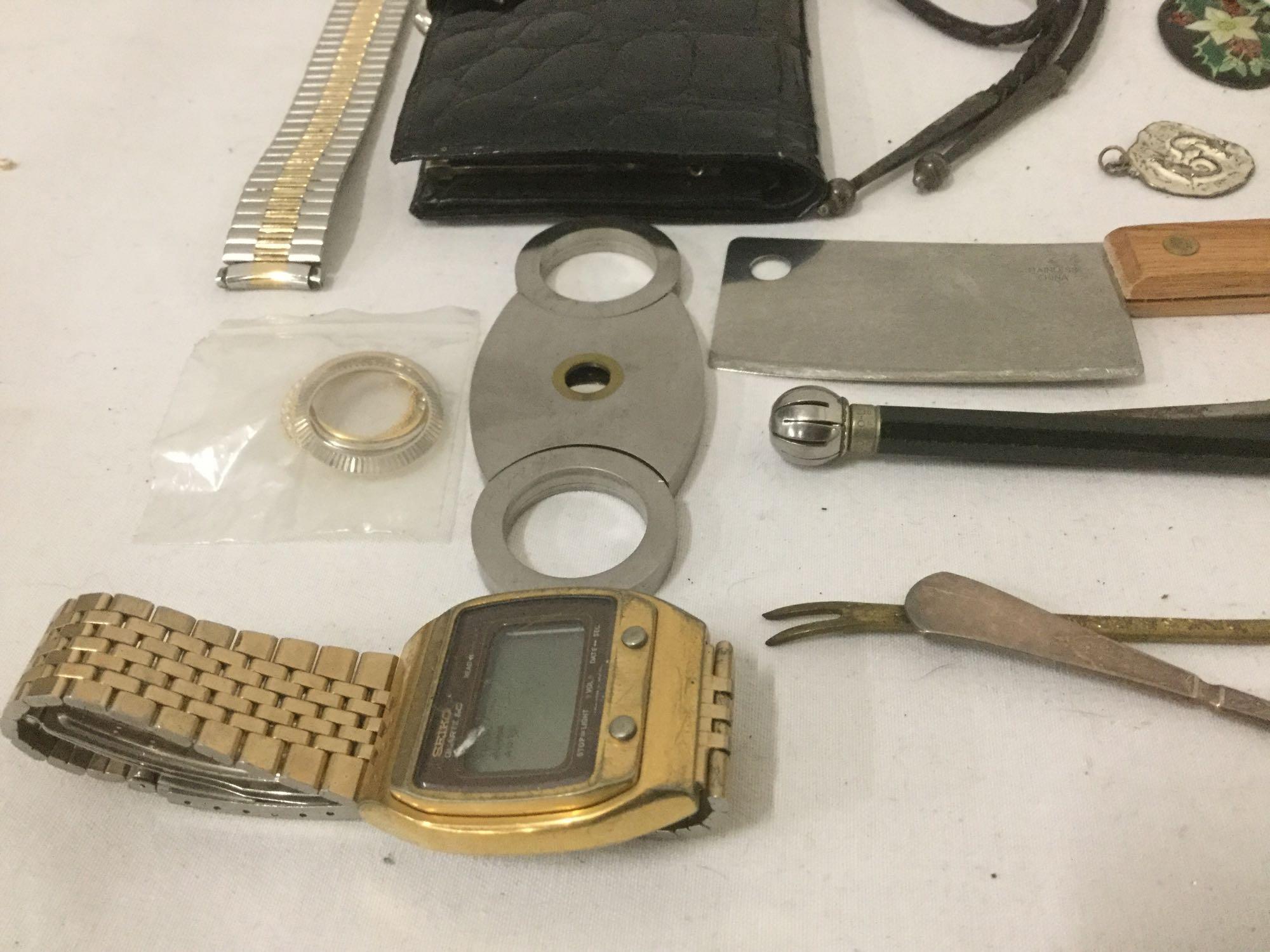 Large bag of mixed items: pocket knife, belt buckles, watches, sun dial & more