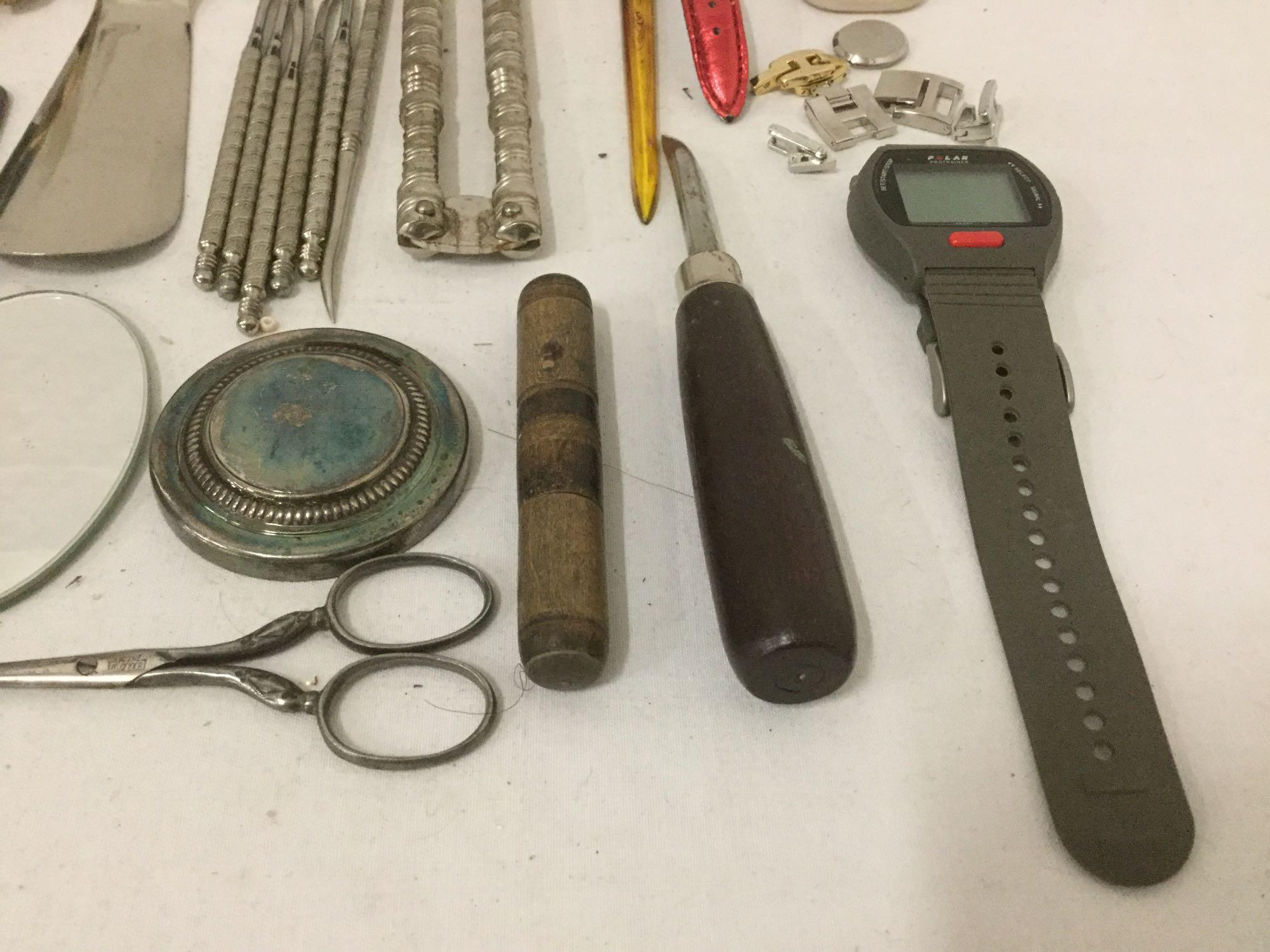 Large bag of mixed items: pocket knife, belt buckles, watches, sun dial & more